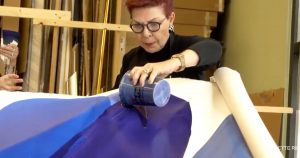 Bette Ridgeway demonstrates her paint pouring technique in her studio