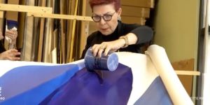 Bette Ridgeway demonstrates her paint pouring technique in her studio