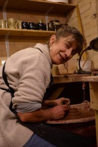 Kate Charlton-Jones at her pottery wheel
