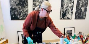 Nancy McTague Stock working in her studio