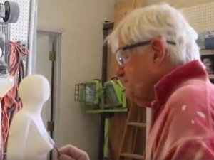 Mark Yale Harris carving stone in his studio