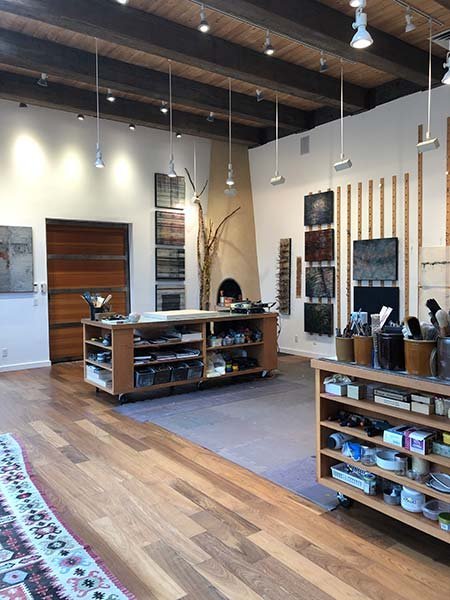 Two open tables for work and storage in Catherine Eaton Skinner's Santa Fe studio