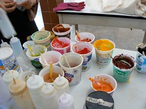 Cups of paint used in Jo Stealey's studio