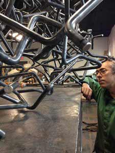 Joshua Enck and metal bars in his studio