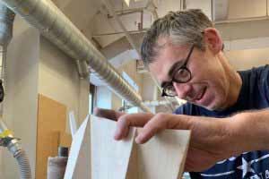 Joshua Enck working on wood in his studio