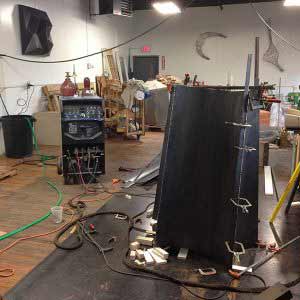Joshua Enck’s studio space, with his metal and wood work