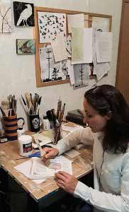 Maya Kuvaja painting in her studio