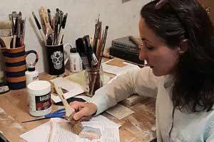 Maya Kuvaja painting in her studio