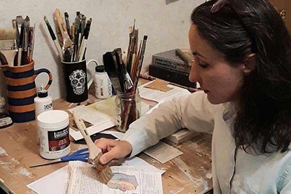 Maya Kuvaja painting in her studio