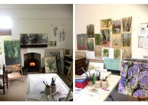 Paintings of trees hung on the walls of an art studio