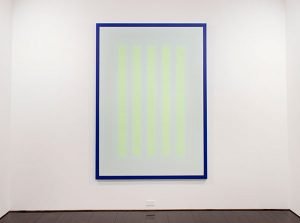 A painting of yellow neon vertical stripes on a white background, with a bright blue border