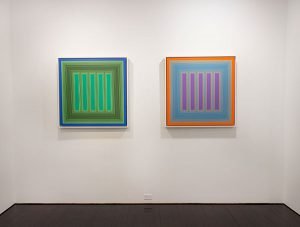 two paintings of neon vertical stripes among other colors