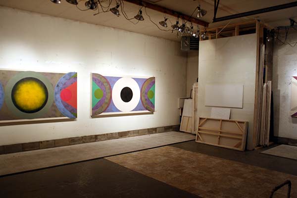 Paintings line the wall of Sokoloff's studio