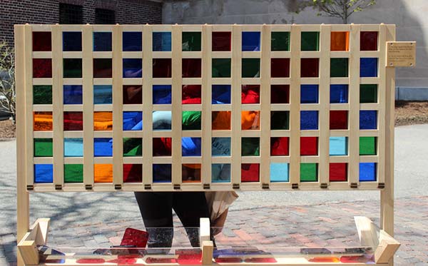 An interactive art installation where bystanders place colored squares into a grid