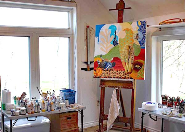 A work of Ferdinands hangs on an easel in the corner of her studio