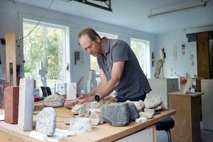 Mark Webber works in his studio in the Hamptons