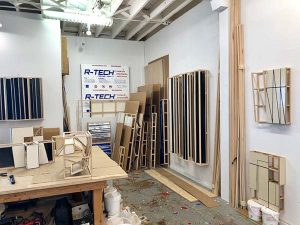 Works of art in progress and wood material in an artist's studio