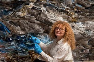 Etty Yaniv works on a mixed media installation
